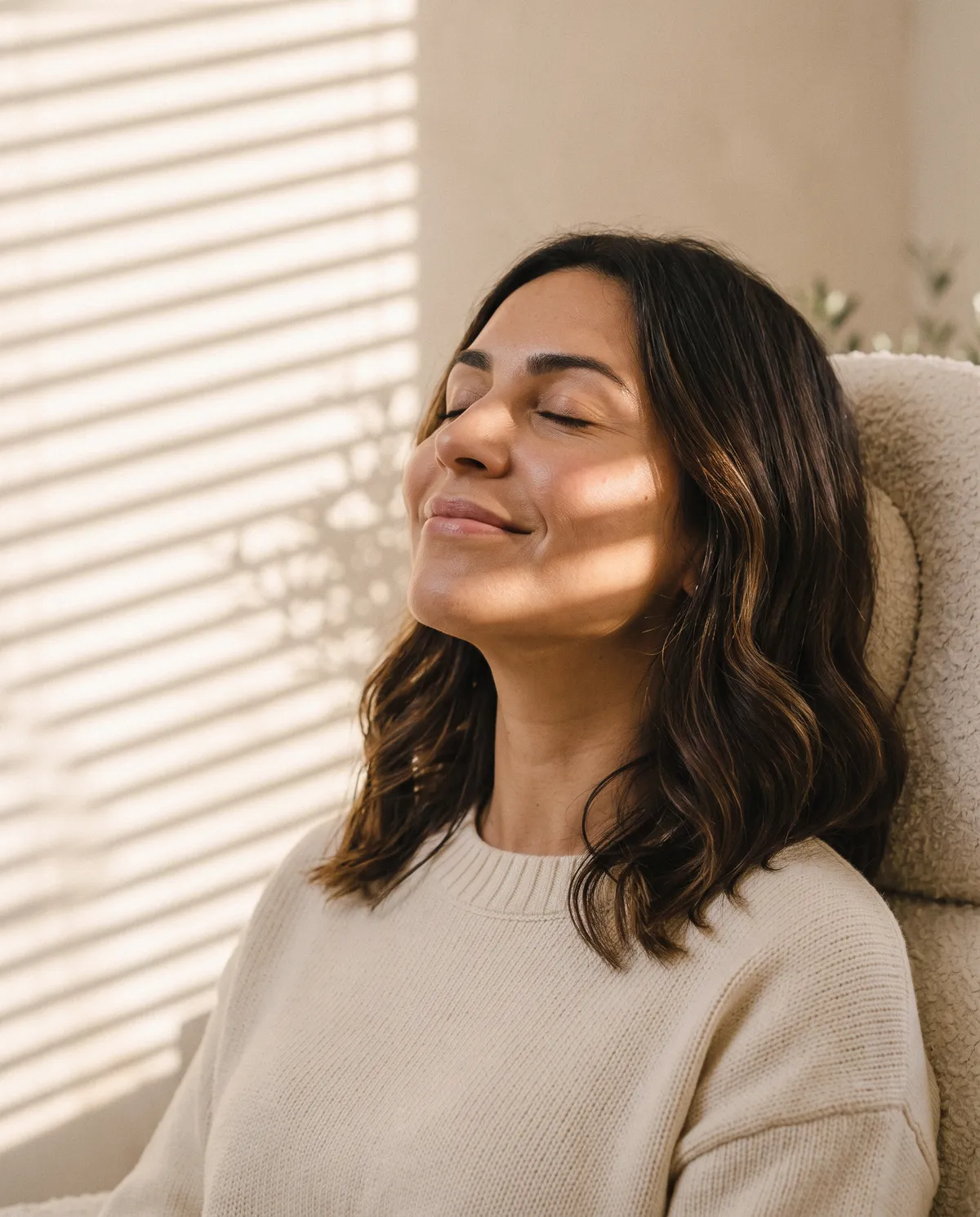 Ana, a client, eyes closed in the late sun after her visit